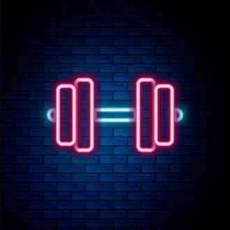 A Glowing Barbell Neon Sign Hung On The Brick Wall Background