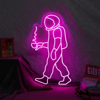 The Astronaut Coffee Neon Sign is a vibrant and eye-catching piece of wall decor that is perfect for any coffee shop or cafe. The sign features a bold and colorful illustration of an astronaut floating in space, holding a cup of coffee in their hand. The 