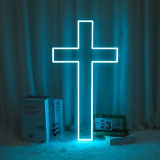 "The Christianity Cross Neon Sign is a bright and vibrant display of the iconic Christian symbol. The cross is displayed in bold, neon colors, standing out against a dark background. The sign is perfect for hanging in a church, chapel, or religious center