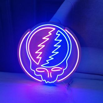 The neon tubes are set against a clear background, which allows the vibrant colors of the sign to stand out and catch the eye of anyone who happens to pass by. The sign is a popular piece of memorabilia for fans of the band, as it captures the fun and pla