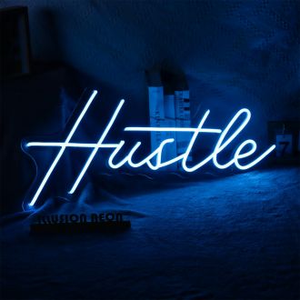 The Hustle neon sign is a bold and vibrant piece of decor that is sure to catch the eye of anyone who passes by. The bright blue neon lights up the letters, giving them a lively and energetic feel that is perfect for any space. The word "Hustle" is writte