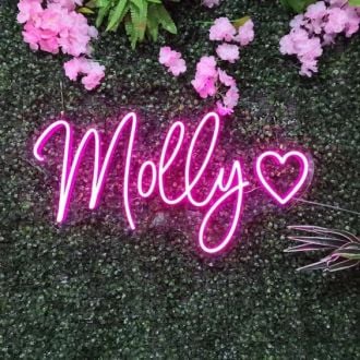 Molly Neon Name Signs Hung On Grass Wall