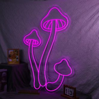 The Mushroom Neon Sign is a vibrant and eye-catching display piece that features a bright neon light in the shape of a mushroom. The neon tube is encased in a clear glass enclosure, giving it a unique and illuminating appearance. The sign is mounted on a 